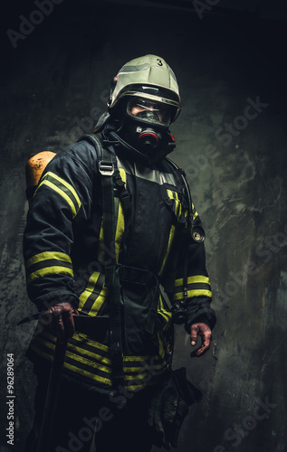 Rescue firefighter in safe helmet and uniform.