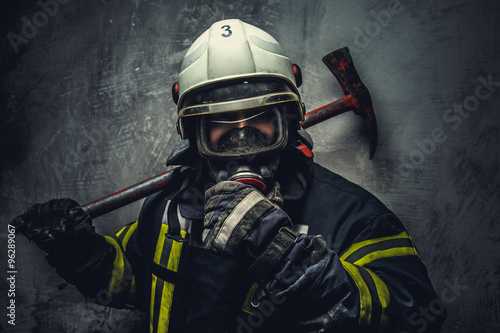 Fototapeta Rescue firefighter in safe helmet and uniform.