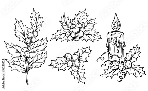 decorative  holly branches and festive candle