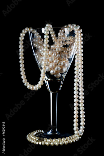 Pearl ornament in a glass wine glass