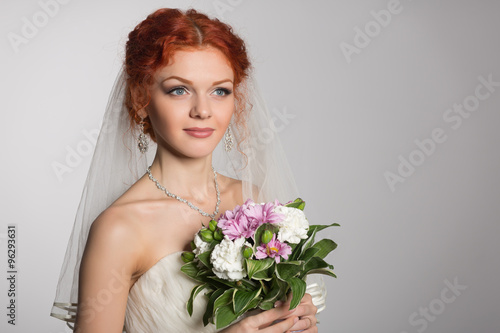 Charming bride with bouquet of flowers