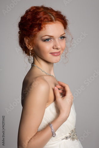 Red haired bride in a wedding dress