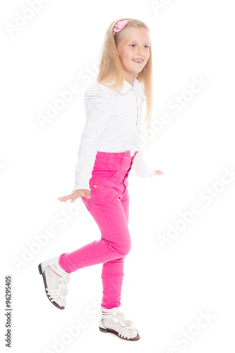 Playful girl in pink jeans.
