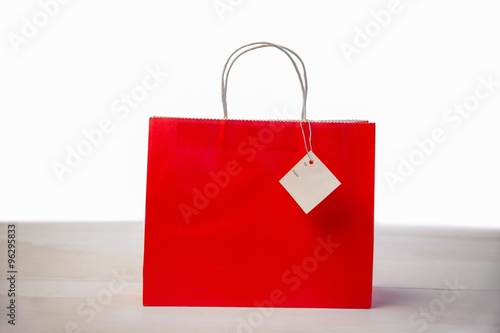 Red shopping gift bag with tag