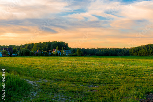 beautiful green field at sunset in the spring