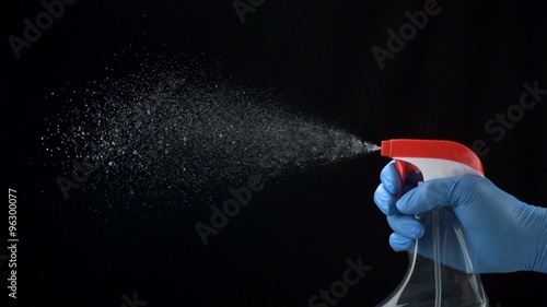 Using spraying bottle and cleaning on black background shooting with high speed camera, phantom flex.