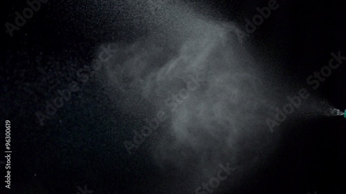 Using spraying bottle and cleaning on black background shooting with high speed camera, phantom flex.