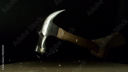 Hammering nail on wood panel shooting with high speed camera, phantom flex.