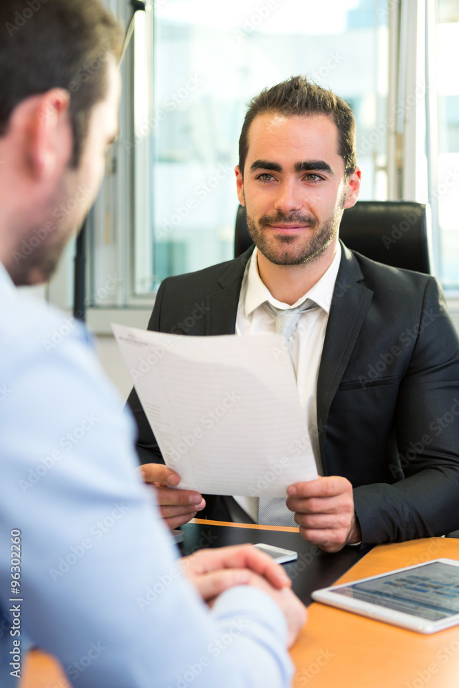 Attractive boss doing interview with his assistant Attractive boss doing interview with his assistant