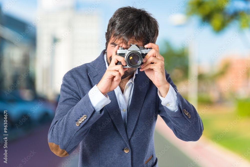 Man photographing over white background Man photographing over white background
