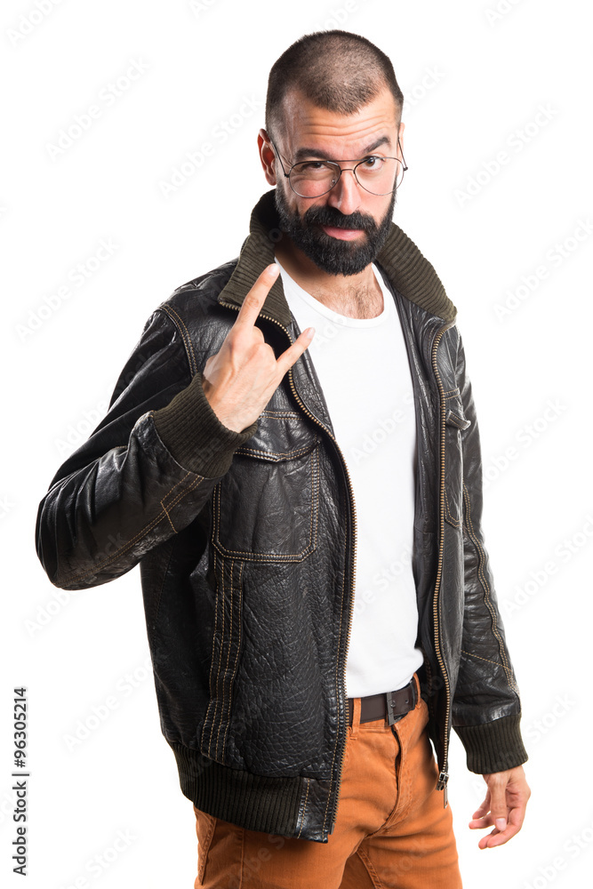 Man with leather jacket making horn gesture Man with leather jacket making horn gesture