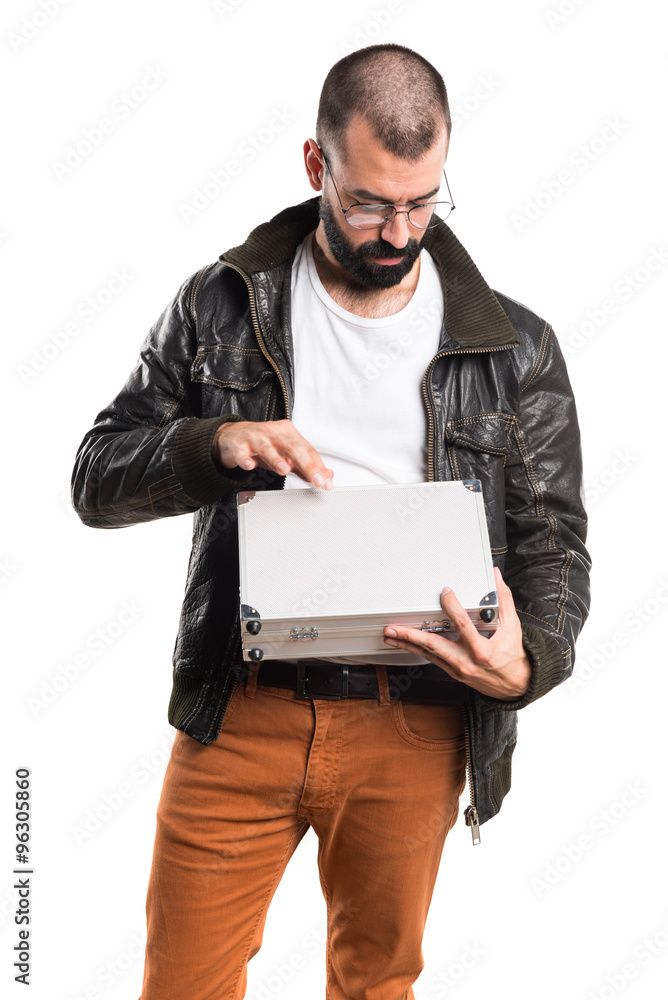 Man wearing a leather jacket holding a briefcase Man wearing a leather jacket holding a briefcase