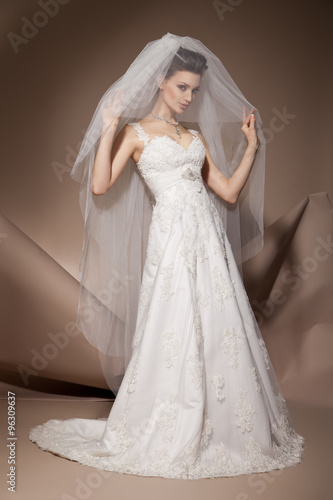 The beautiful young woman in a wedding dress