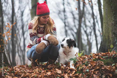 Wallpaper Mural Young woman and her dog posing outdoor in the forest Torontodigital.ca