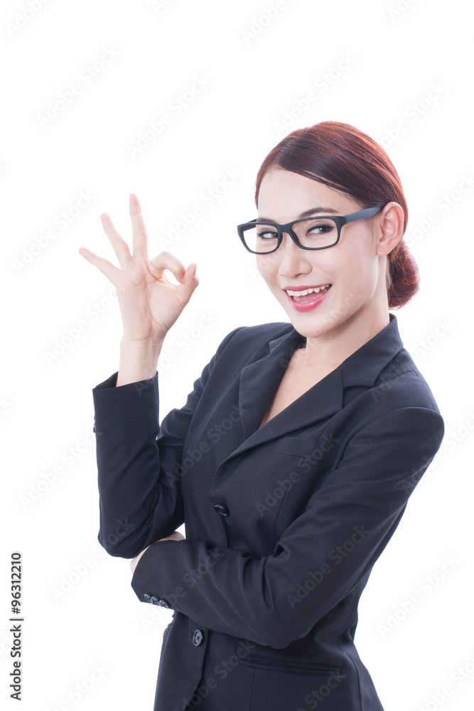 Portrait of young businesswoman wearing glasses with showing ok sign. Portrait of young businesswoman wearing glasses with showing ok sign.