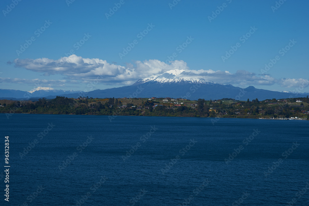 Snow capped Volcano Calbuco (2,105 metres) on the edge of Llanquihue Lake in Southern Chile. Viewed from Puerto Varas. Snow capped Volcano Calbuco (2,105 metres) on the edge of Llanquihue Lake in Southern Chile. Viewed from Puerto Varas.