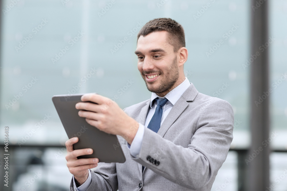 smiling businessman with tablet pc outdoors smiling businessman with tablet pc outdoors