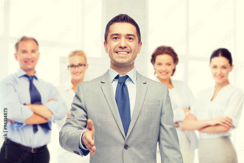 happy smiling businessman in suit shaking hand happy smiling businessman in suit shaking hand