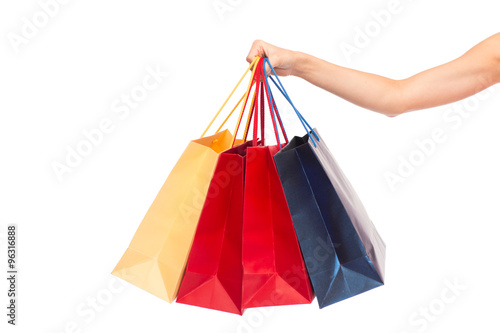 close up of female hand holding shopping bags