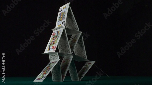 Pyramid house of playing cards falling down shooting with high speed camera, phantom flex.