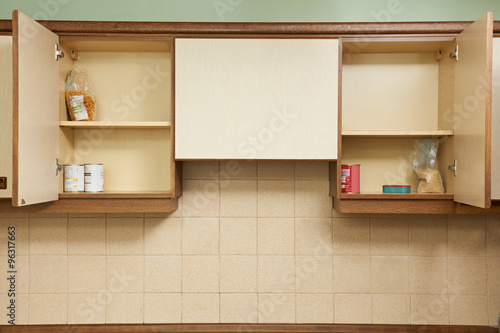 Fotografie Empty Kitchen Cupboards