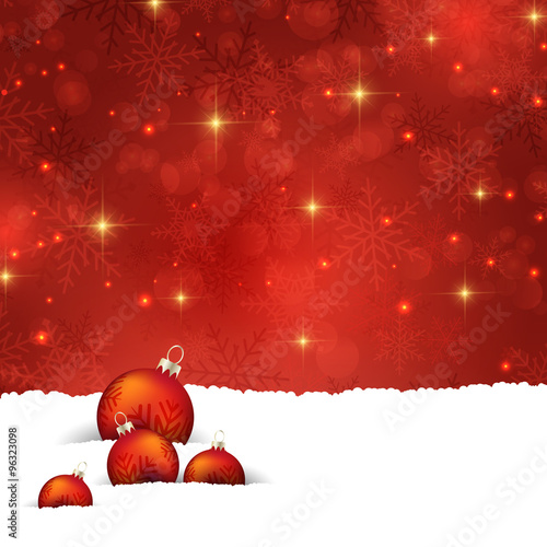 Christmas baubles nestled in snow