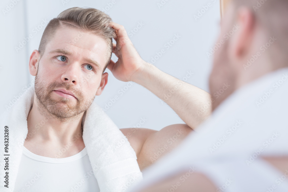 Guy looking at the mirror Guy looking at the mirror