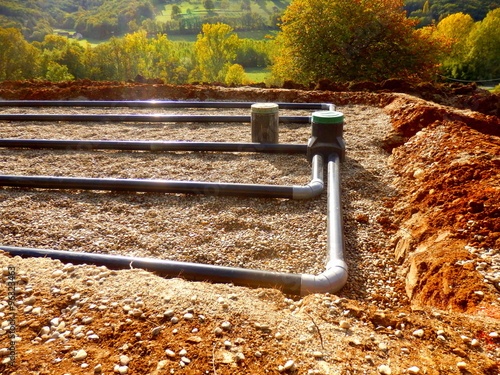 The top layer of pipework, after the membrane, sand and gravel had been applied, during the construction of a sand and gravel drainage system photo