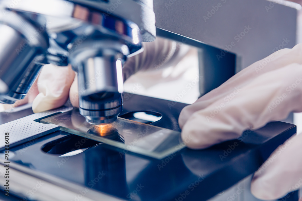 Scientist hands with microscope Scientist hands with microscope