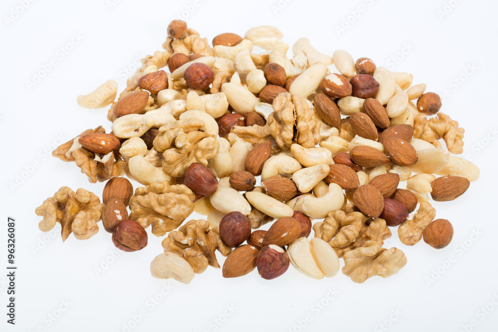 mixed nuts - hazelnuts, walnuts, cashews, pine nuts isolated on white background mixed nuts - hazelnuts, walnuts, cashews, pine nuts isolated on white background