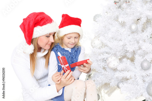 Happy family with Christmas gift.