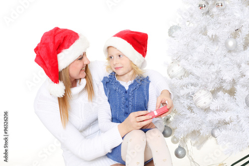 Happy family with Christmas gift.