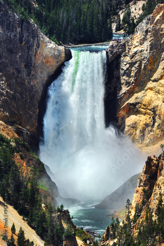 Full view of Lower Falls shows brink and bottom where a huge splash shows the power of the falls.  