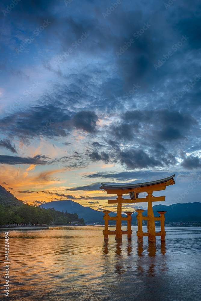 Sunset at the famous floating torii gate of the Itsukushima Shri Sunset at the famous floating torii gate of the Itsukushima Shri