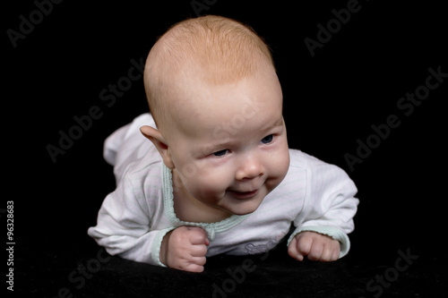 infant isolated on a black background