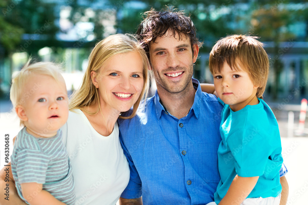 Fototapeta premium Young family with two kids 