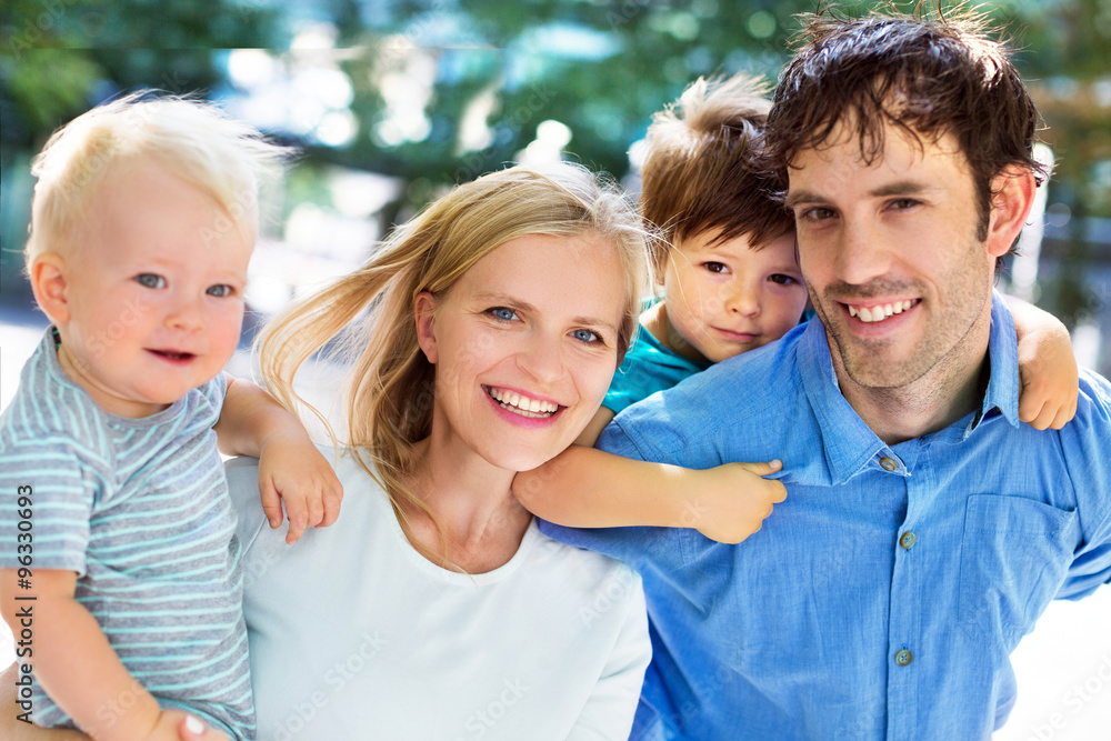 Fototapeta premium Young family with two kids