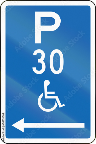 New Zealand road sign - Parking zone reserved for disabled persons with time limit, on the left of this sign