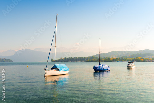 Sailboats on Lake Lucerne. In the background Swiss Alps mountain range. Switzerland