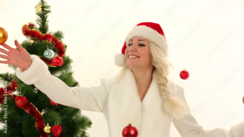 Happy Young Lady Playing With Decorations In Christmas Costume Happy Young Lady Playing With Decorations In Christmas Costume