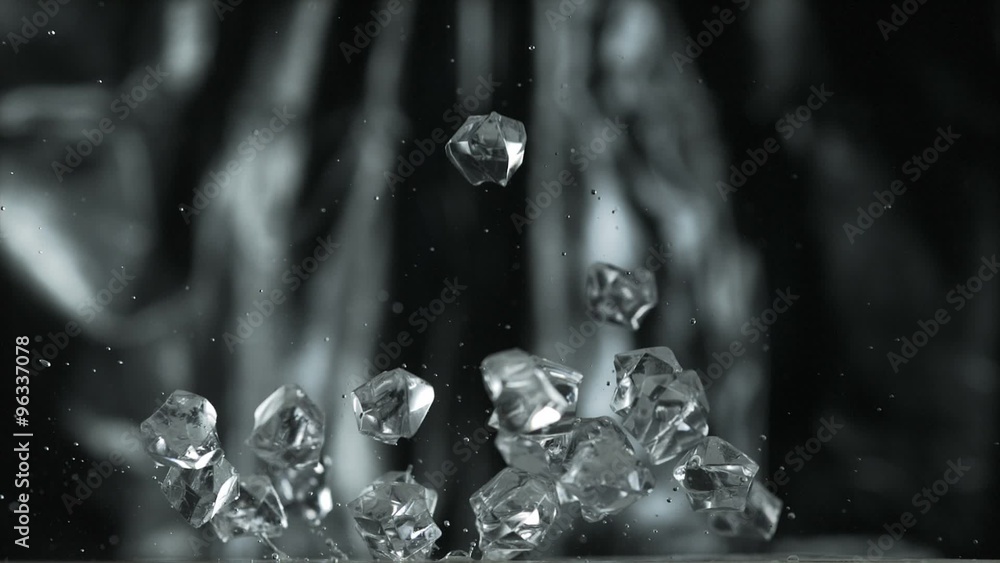 Cubes falling and bouncing on puddle shooting with high speed camera, phantom flex. Cubes falling and bouncing on puddle shooting with high speed camera, phantom flex.