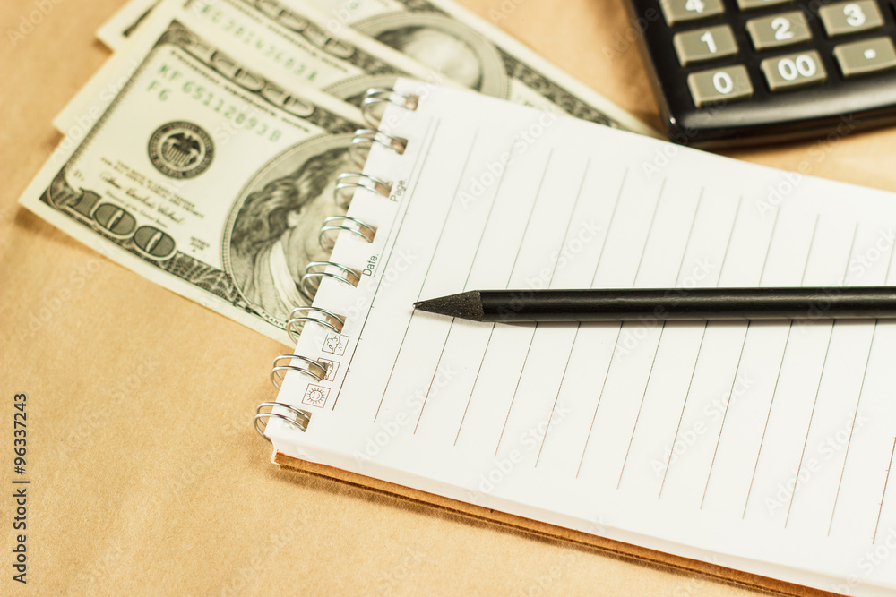 Image of money and a calculator, home budget Image of money and a calculator, home budget