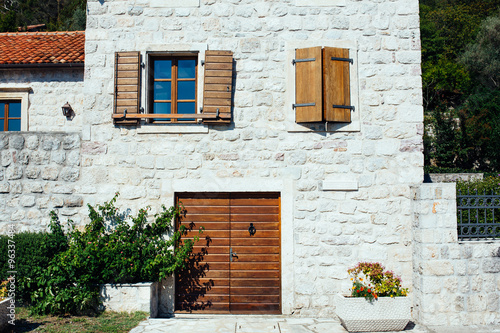 House with wooden shutters and door. Montenegro