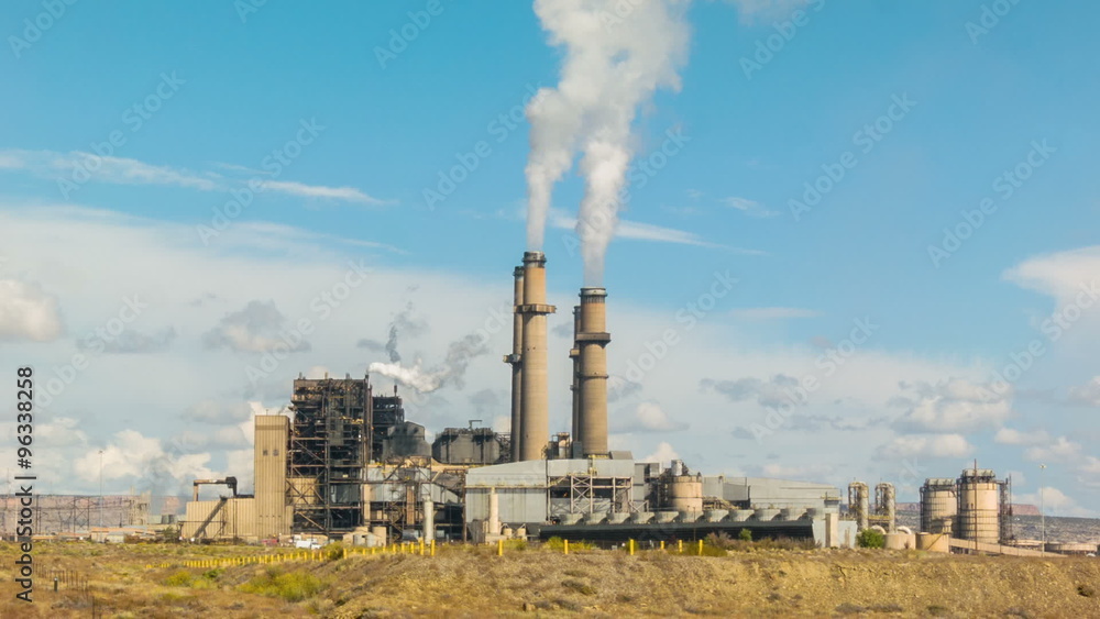 Electricity generating power station with belching chimneys