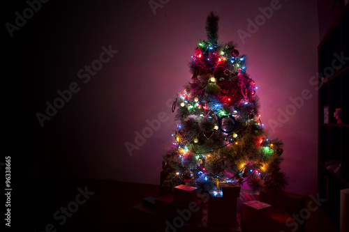 Snow Covered Christmas Tree with Multi Colored Lights