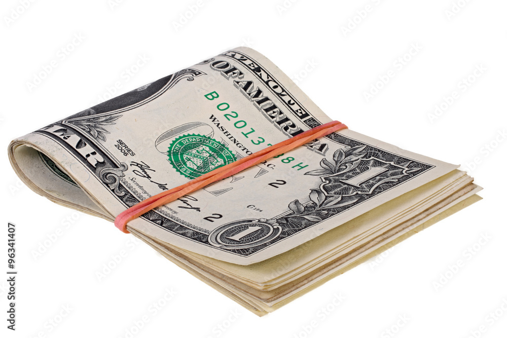 Pack of dollars fastened by an elastic band on a white background Pack of dollars fastened by an elastic band on a white background