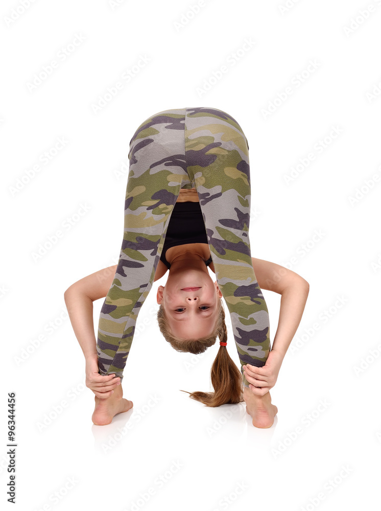 Active little girl doing yoga exercise Stock Photo