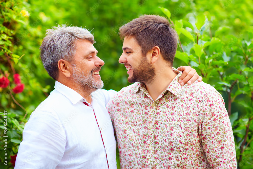 portrait of happy father and son, that are similar in appearance portrait of happy father and son, that are similar in appearance
