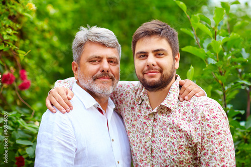 Photography portrait of happy father and son, that are similar in appearance