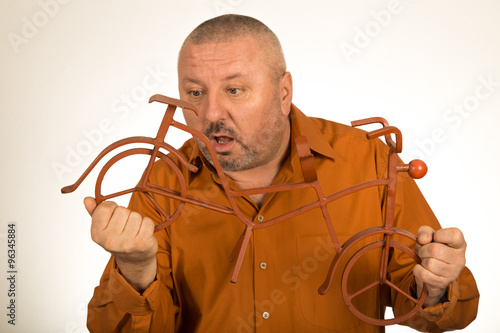 Big man holding scale model of the bike/bicycle photo